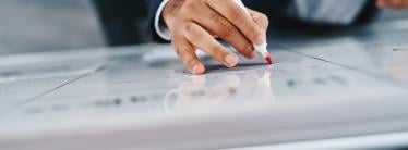 Businessman writing on a whiteboard