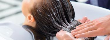 A woman getting her hair washed