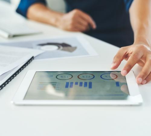 SME founder runs analytics using tablet