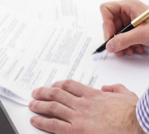 Person signing a contract